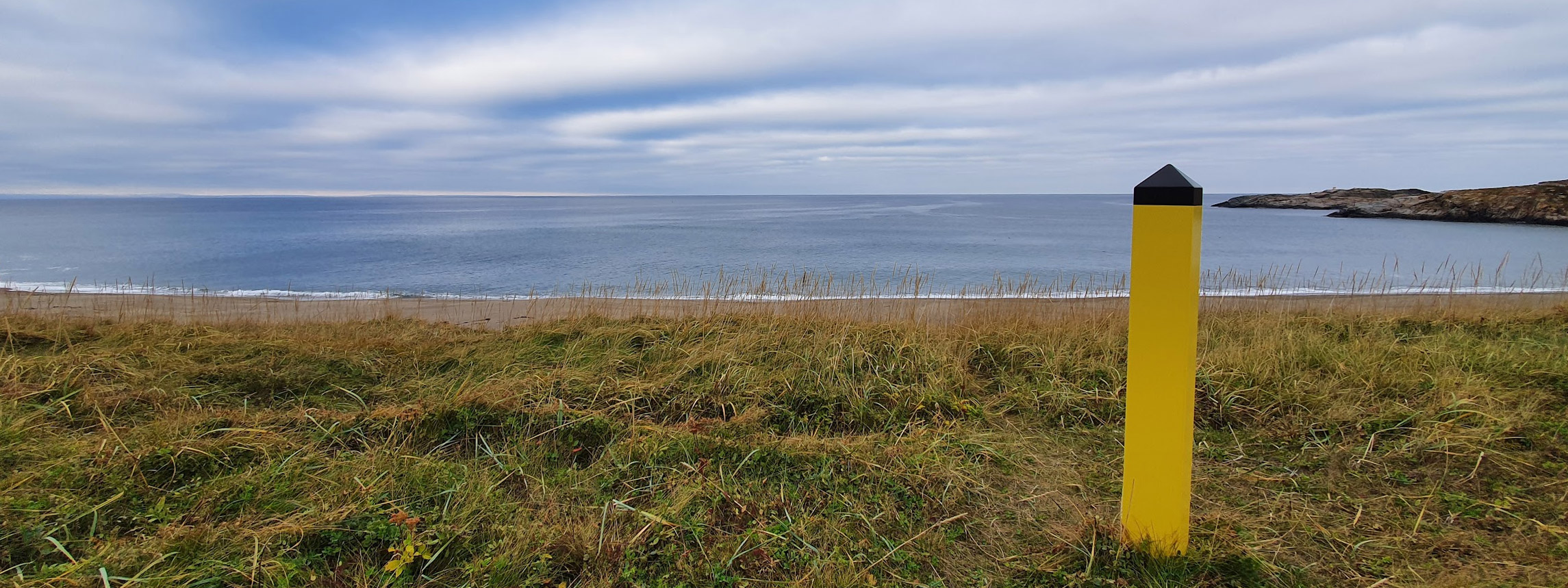 Utsikt ut mot havet fra Grense Jakobselv i Sør-Varanger i Finnmark. Foto: Steinar Ittelin, Kartverket